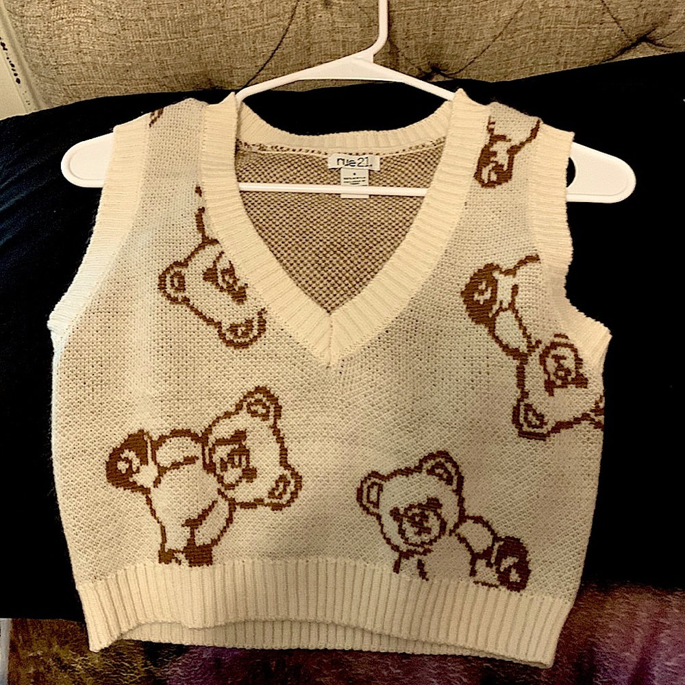 A brown cream color cloth vest